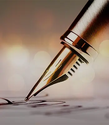 Signing a signature with a fountain pen.
